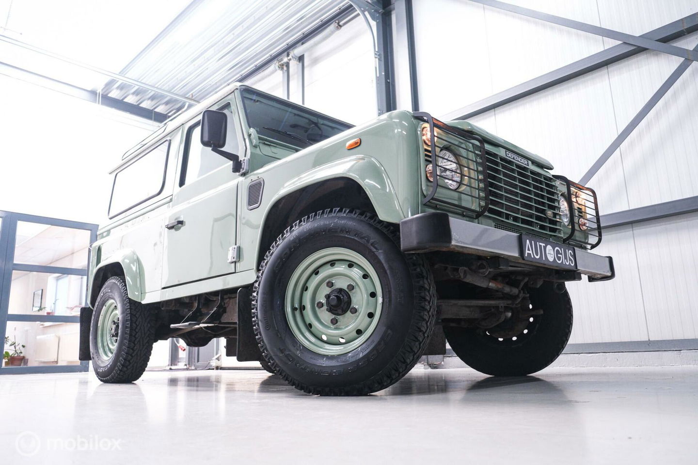 Land Rover Defender 90 2.5 Td5 | HUE 166 | Grasmere Green | Heritage | NL auto NAP | 2e eigenaar | A-Z onderhouden | Unieke auto |