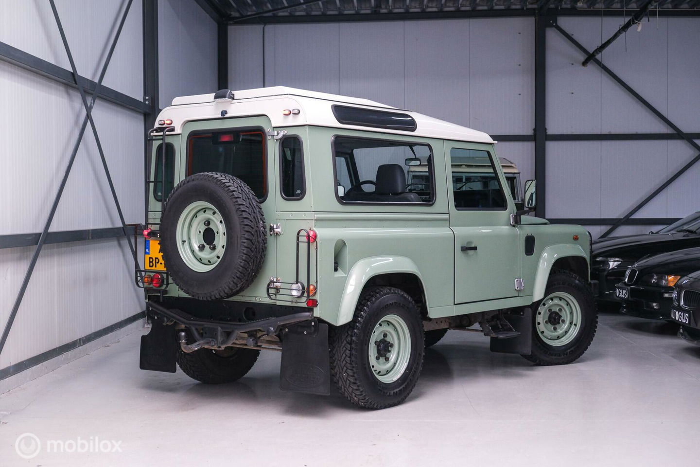 Land Rover Defender 90 2.5 Td5 | HUE 166 | Grasmere Green | Heritage | NL auto NAP | 2e eigenaar | A-Z onderhouden | Unieke auto |