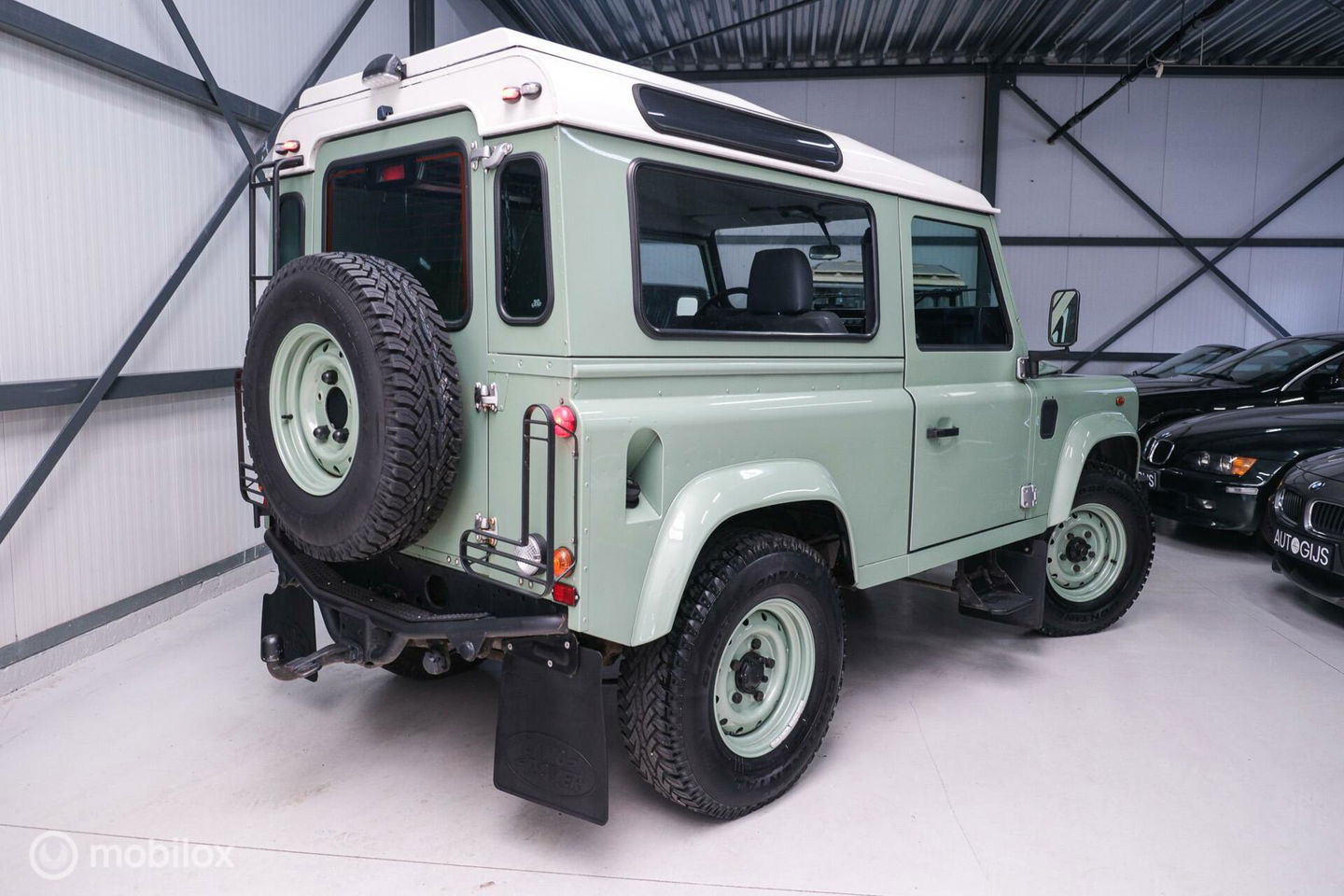 Land Rover Defender 90 2.5 Td5 | HUE 166 | Grasmere Green | Heritage | NL auto NAP | 2e eigenaar | A-Z onderhouden | Unieke auto |