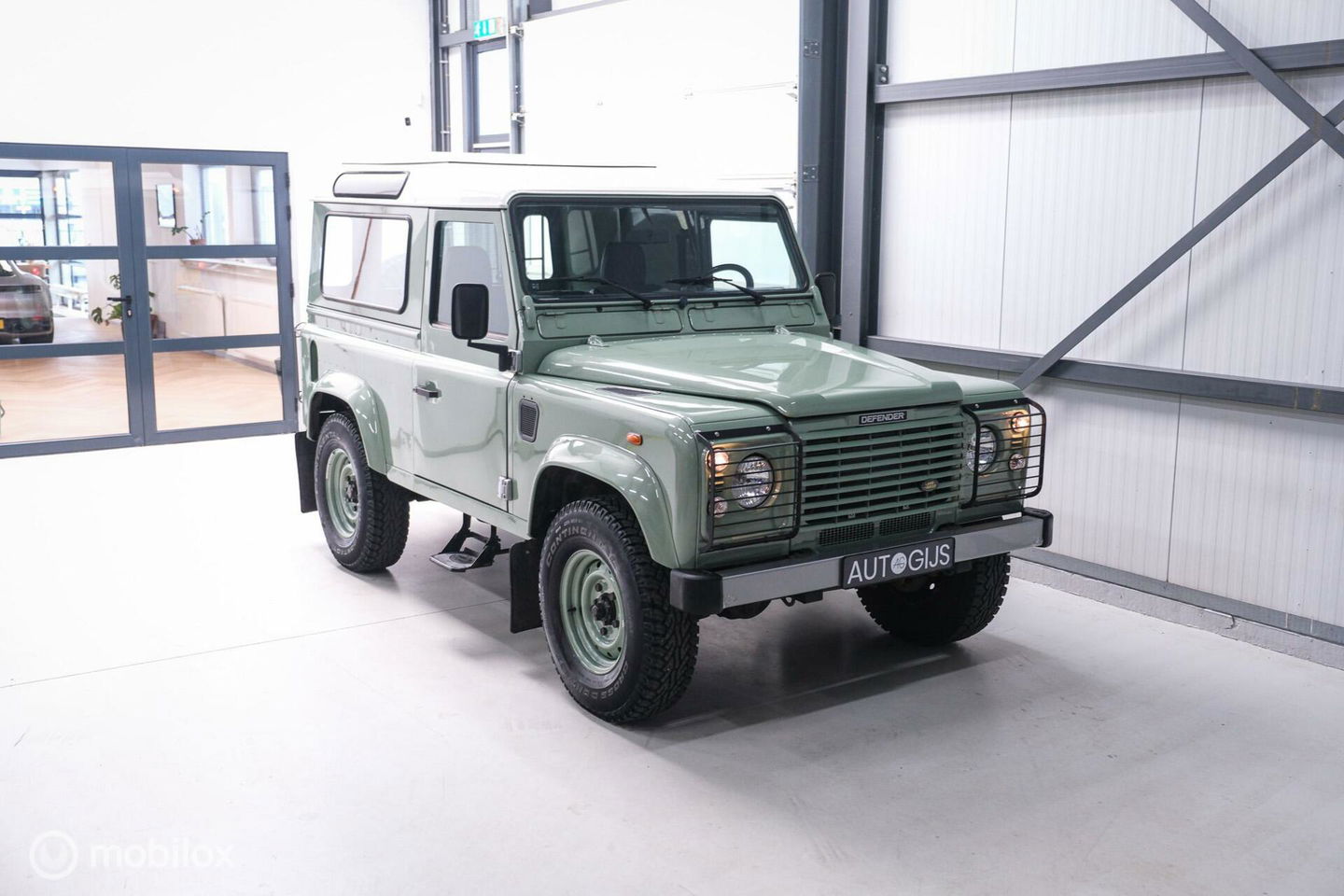 Land Rover Defender 90 2.5 Td5 | HUE 166 | Grasmere Green | Heritage | NL auto NAP | 2e eigenaar | A-Z onderhouden | Unieke auto |