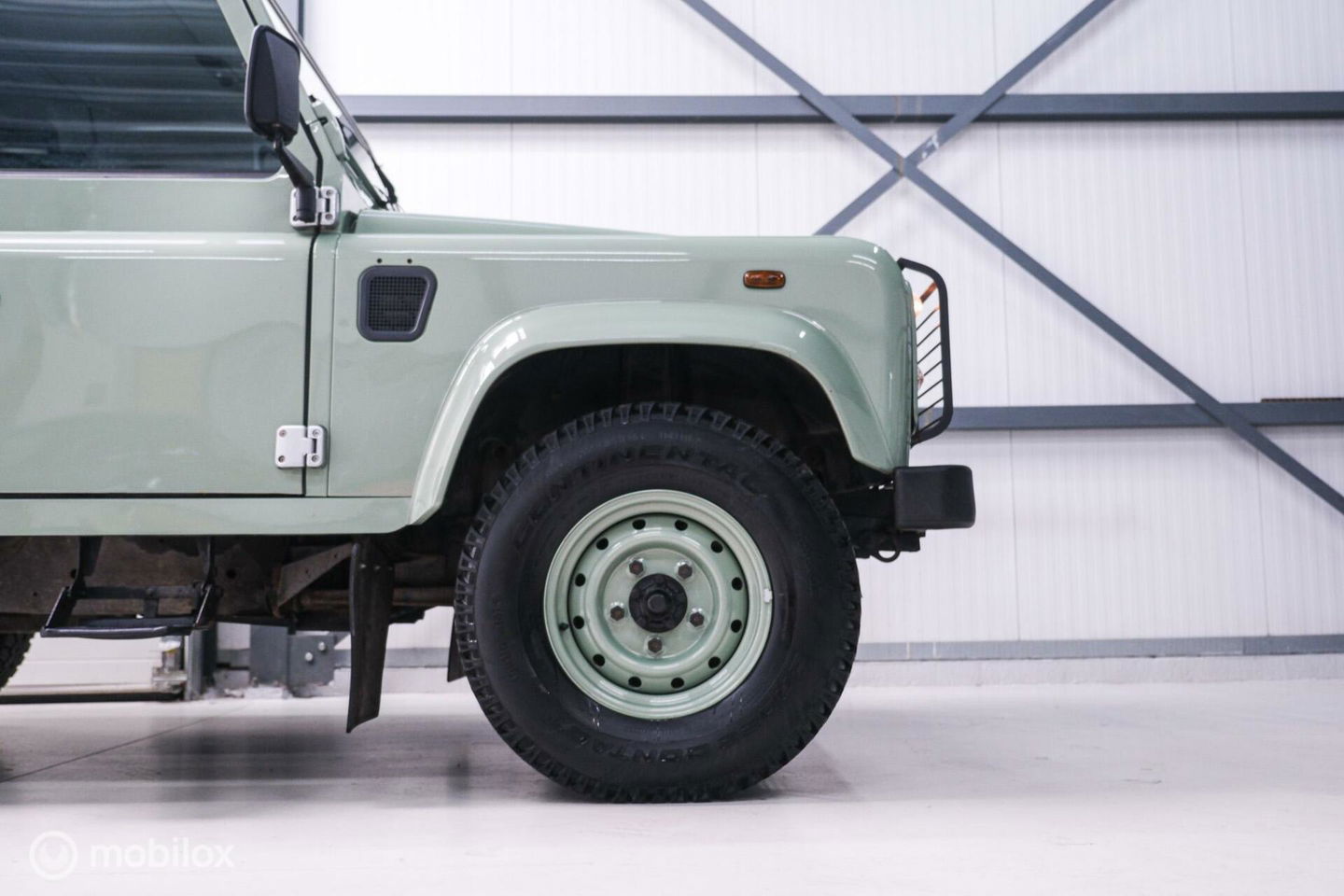 Land Rover Defender 90 2.5 Td5 | HUE 166 | Grasmere Green | Heritage | NL auto NAP | 2e eigenaar | A-Z onderhouden | Unieke auto |