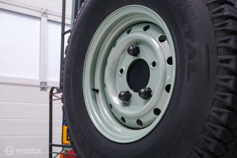 Land Rover Defender 90 2.5 Td5 | HUE 166 | Grasmere Green | Heritage | NL auto NAP | 2e eigenaar | A-Z onderhouden | Unieke auto |