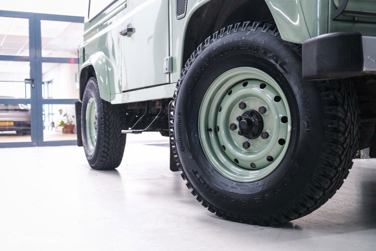 Land Rover Defender 90 2.5 Td5 | HUE 166 | Grasmere Green | Heritage | NL auto NAP | 2e eigenaar | A-Z onderhouden | Unieke auto |