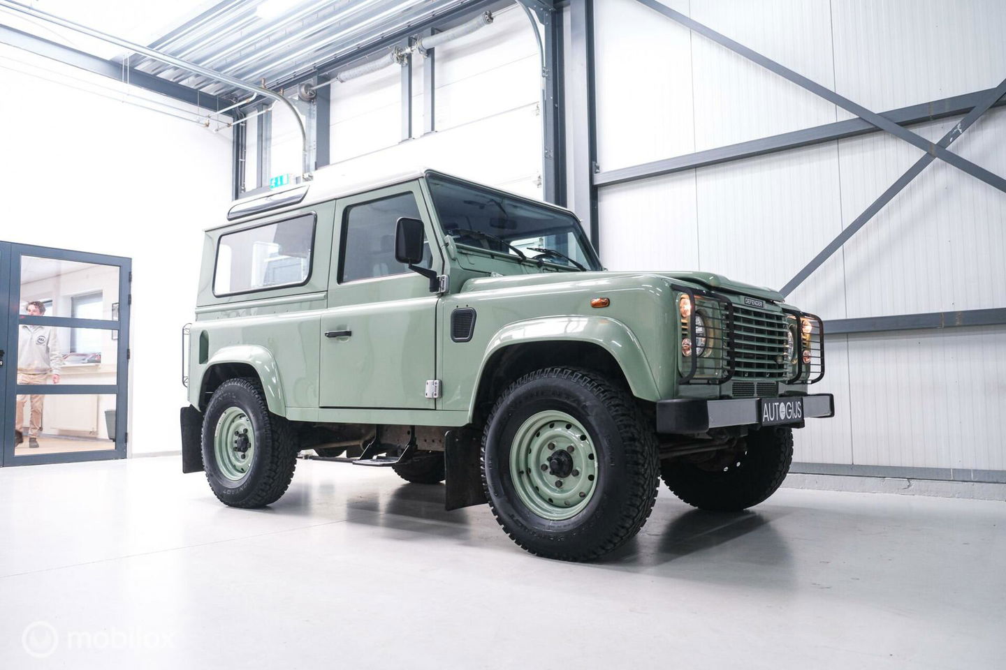 Land Rover Defender 90 2.5 Td5 | HUE 166 | Grasmere Green | Heritage | NL auto NAP | 2e eigenaar | A-Z onderhouden | Unieke auto |