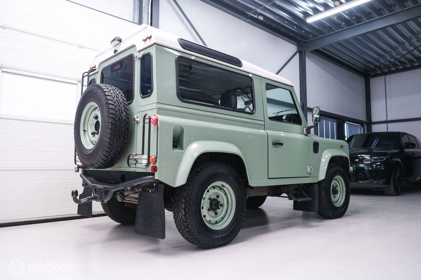 Land Rover Defender 90 2.5 Td5 | HUE 166 | Grasmere Green | Heritage | NL auto NAP | 2e eigenaar | A-Z onderhouden | Unieke auto |