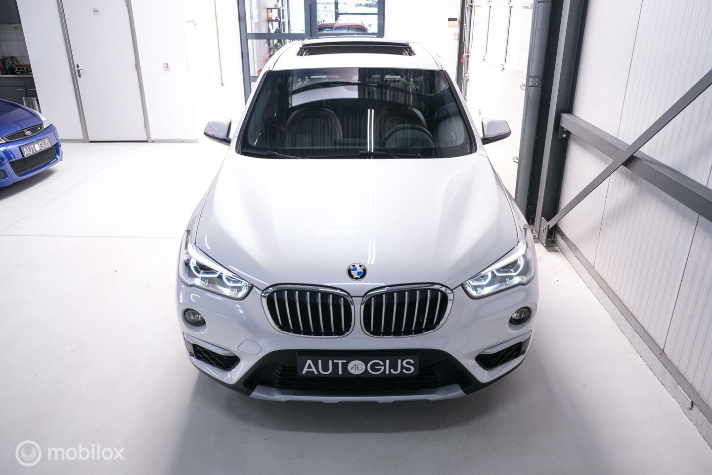 BMW X1 xDrive20i High Executive | 4x4 | HUD | Trekhaak | Leder | Orig NL auto | Dealer onderhouden | Camera | rijklaarprijs |