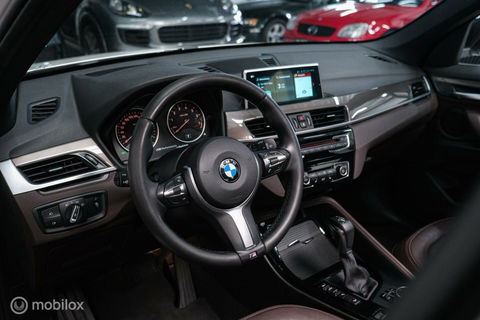 BMW X1 xDrive20i High Executive | 4x4 | HUD | Trekhaak | Leder | Orig NL auto | Dealer onderhouden | Camera | rijklaarprijs |
