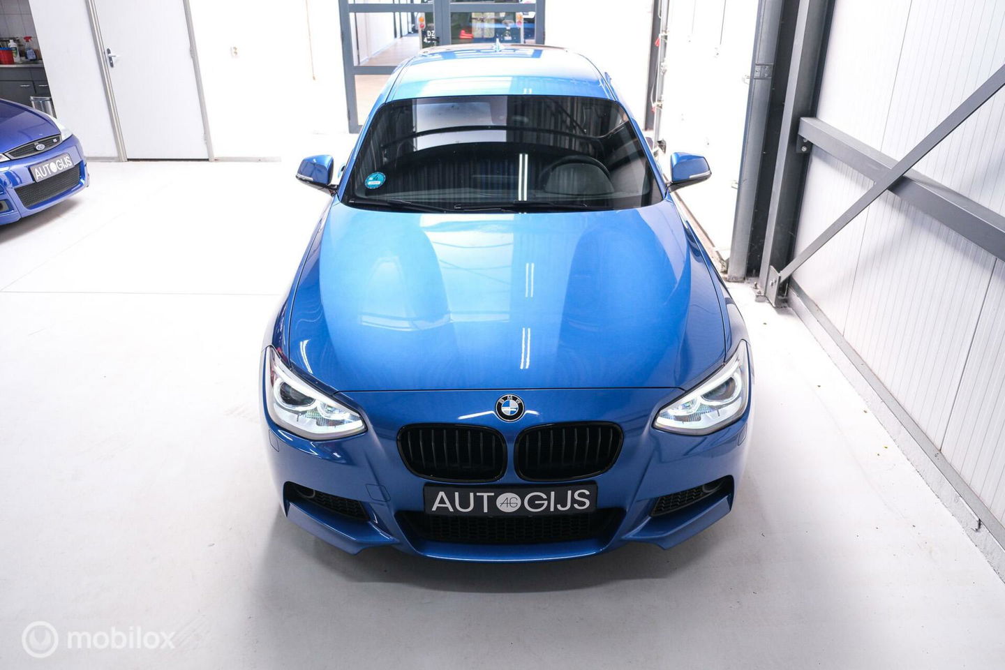 BMW 1-serie 116i M Sport | Estoril blue | Alcantara | LED | M performance | unieke auto | NAP orig NL | Trekhaak | 19 inch |