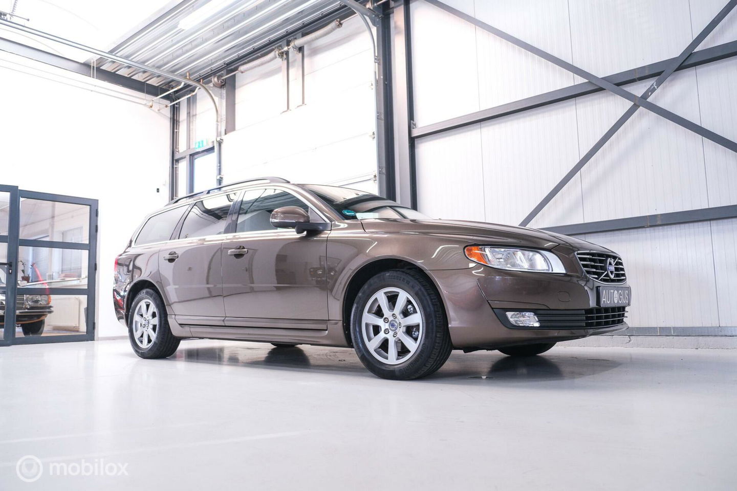 Volvo V70 1.6 T4 Momentum | Schuifdak | trekhaak | nieuwe D-riem | rijklaar | stoelverwarming | navigatie | cruise |