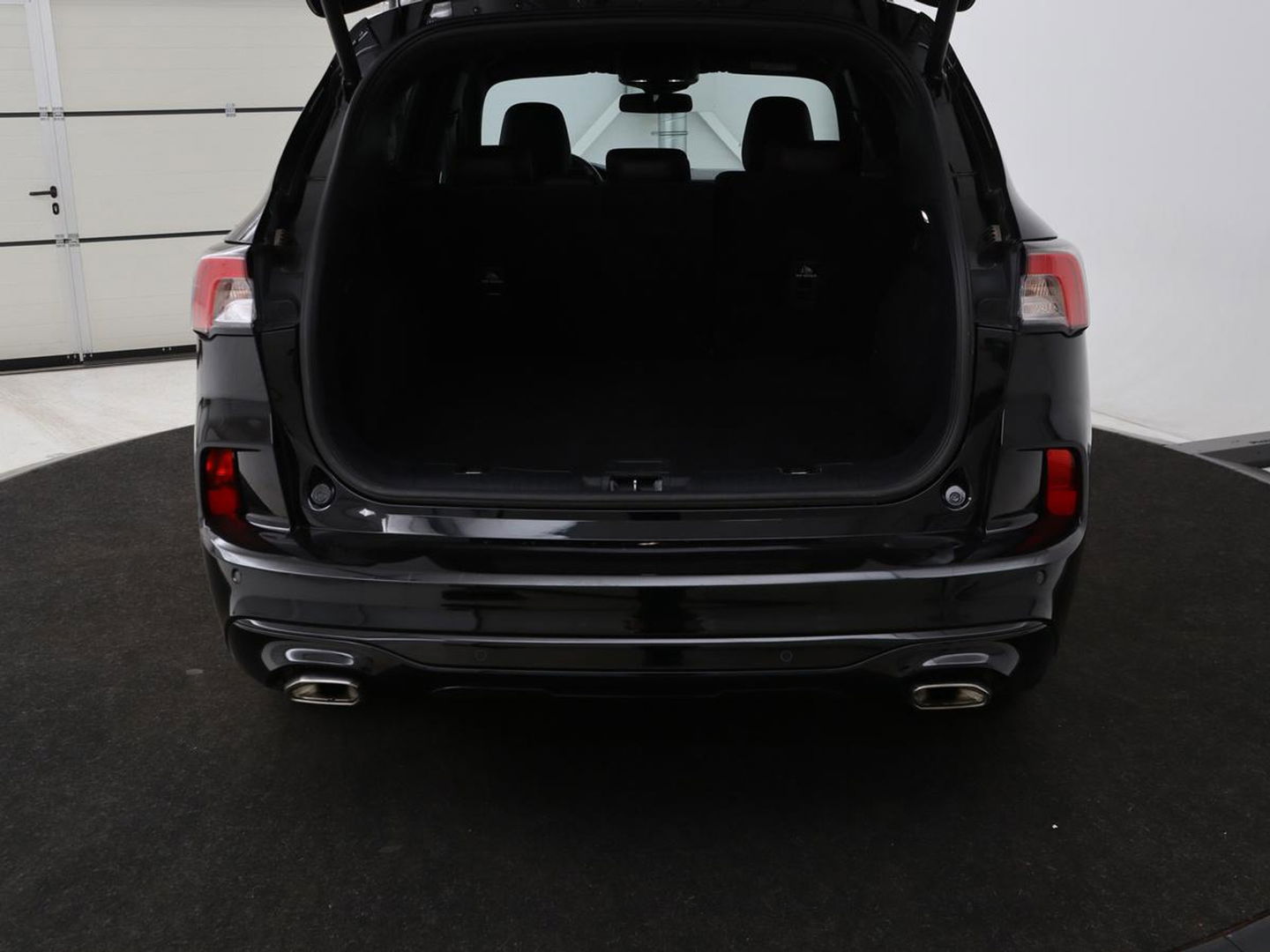 Ford Kuga 2.5 PHEV ST-Line | Stoelverwarming | Carplay | B&O Sound | Leder/Alcantara | Full LED | Keyless | Parkeerhulp | Navigatie | Digital Cockpit | Bluetooth | Climate control