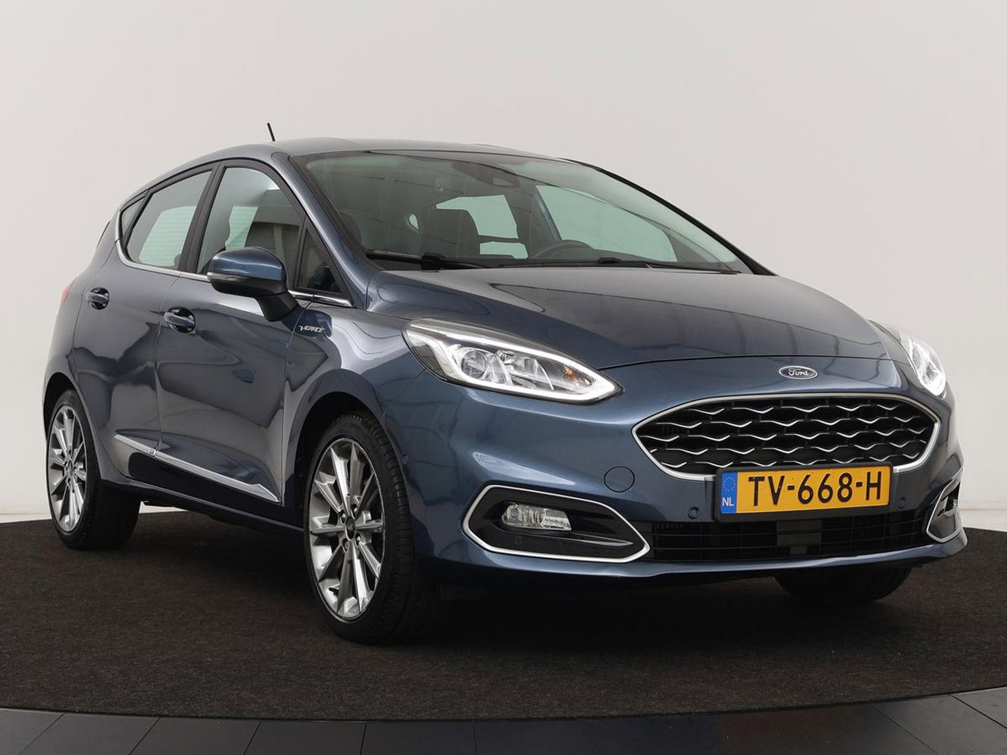 Ford Fiesta 1.0 EcoBoost Vignale | 125pk | Stoel & stuurverwarming | Half leder | B&O Sound | Trekhaak | Carplay | Keyless | Camera | Climate control | Park Assist | Cruise control | Navigatie