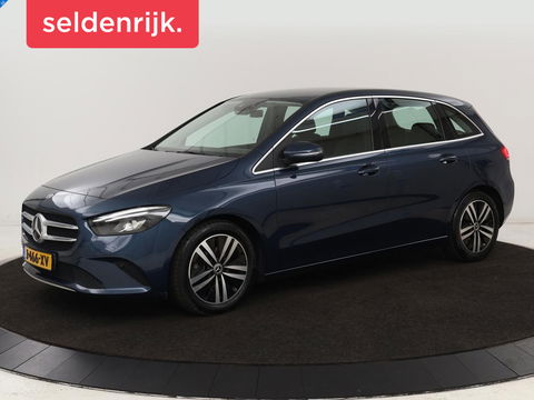 Mercedes-Benz B-Klasse 180 Business Solution Luxury | Leder | Trekhaak | Stoelverwarming | Camera | Navigatie | Full LED | Park Assist | Sfeerverlichting | Widescreen