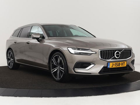 Volvo V60 2.0 T6 Recharge AWD Business Pro | Leder | Trekhaak | Stoel & stuurverwarming | Camera | Adaptive cruise | Achterbankverwarming | Carplay | Keyless | Full LED | Navigatue | PHEV