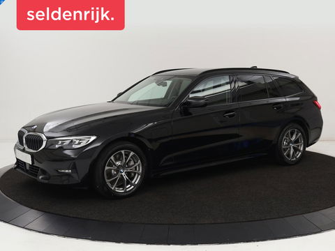 BMW 3-serie 330e Sport Line | Stoel & stuurverwarming | Adaptive cruise | Trekhaak | Sportstoelen | Carplay | Sfeerverlichting | Half leder | Navigatie | Full LED | PHEV