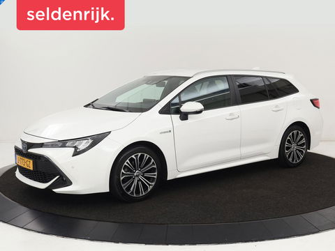 Toyota Corolla 1.8 Hybrid Dynamic | Stoelverwarming | Trekhaak | Camera | Adaptive cruise | Carplay | Navigatie | Parkeerhulp | Climate control