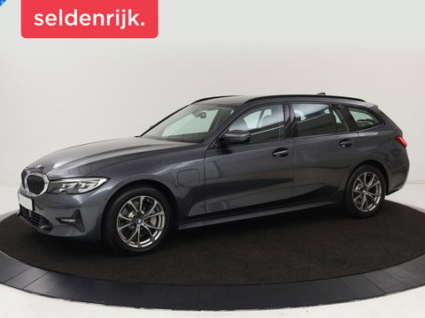BMW 3-serie 330e Sport Line | Stoel & stuurverwarming | Adaptive cruise | Sportstoelen | Trekhaak | Carplay | Sfeerverlichting | Half leder | Navigatie | Full LED