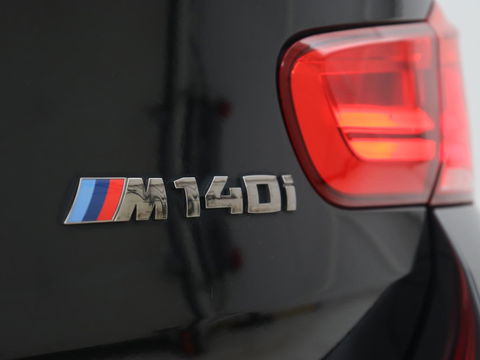 BMW 1-serie M140i High Executive | 2e eigenaar | Schuifdak | Leder | Harman/Kardon | Stoel & stuurverwarming | Camera | Carplay | Full LED | Navigatie