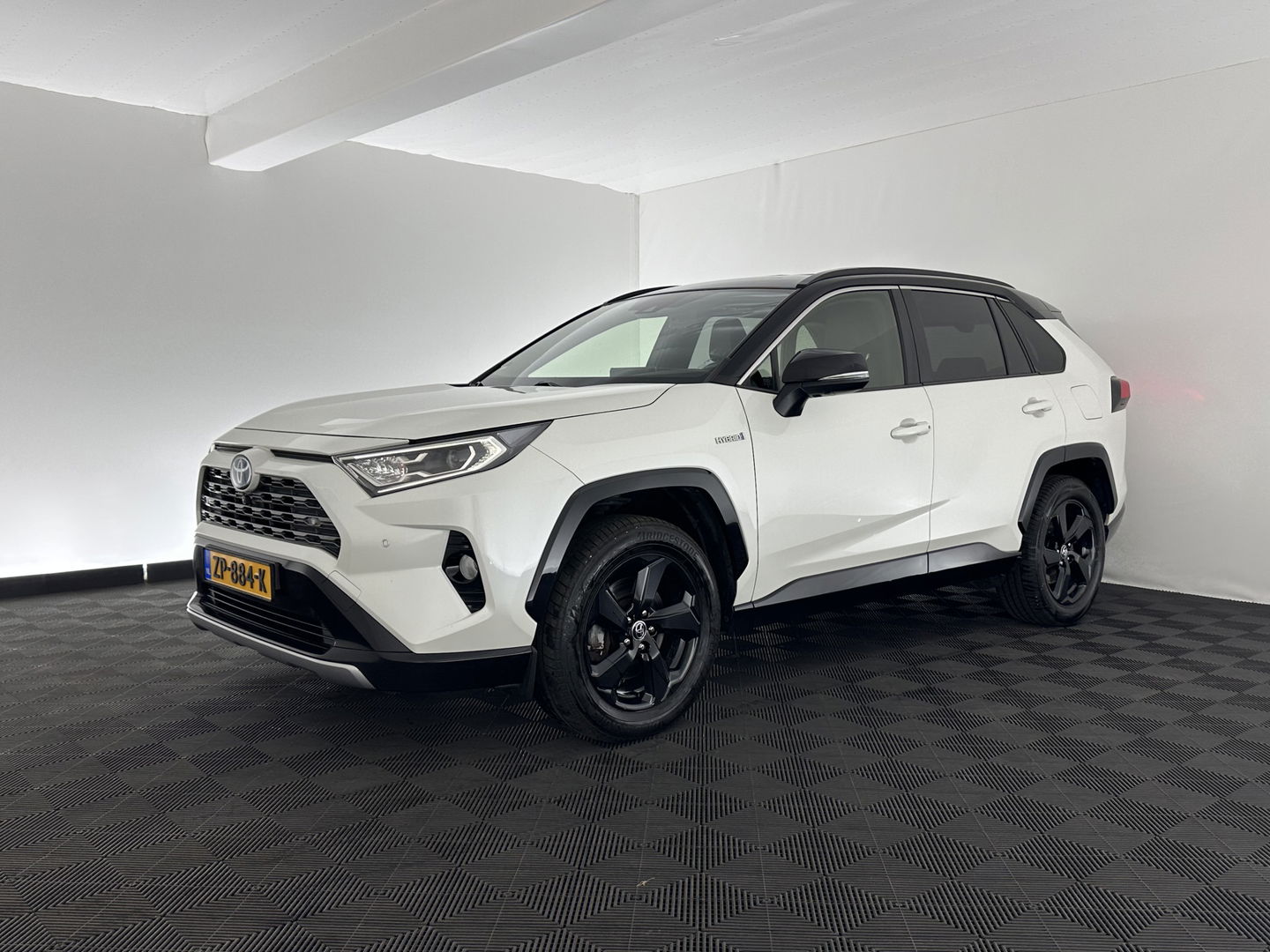 Toyota RAV4 2.5 Hybrid AWD Bi-Tone (INCL.BTW) *LEATHER | FULL-LED | ADAPTIVE-CRUISE | BLINDS-SPOT | TOP-VIEW | JBL-SOUND | KEYLESS | NAVI-FULLMAP | DAB+ | 18''ALU | TOWBAR*