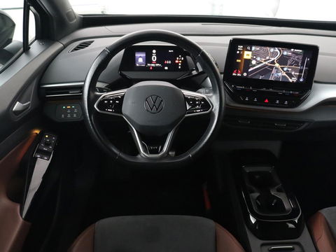 Volkswagen ID.4 Life 77 kWh | Trekhaak | Stoel & stuurverwarming | Camera | Adaptive cruise | Carplay | Navigatie | Parkeerhulp | Half leder