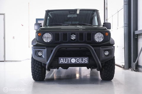 Suzuki Jimny 1.5 All Grip 4x4 | CarPlay | Camera | Stoelverwarming | BF Goodrich | Frontrunner | NL auto NAP | Groen | Lane Assist |