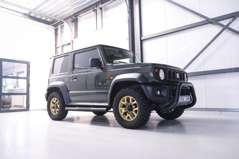 Suzuki Jimny 1.5 All Grip 4x4 | CarPlay | Camera | Stoelverwarming | BF Goodrich | Frontrunner | NL auto NAP | Groen | Lane Assist |