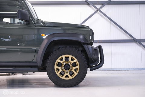 Suzuki Jimny 1.5 All Grip 4x4 | CarPlay | Camera | Stoelverwarming | BF Goodrich | Frontrunner | NL auto NAP | Groen | Lane Assist |
