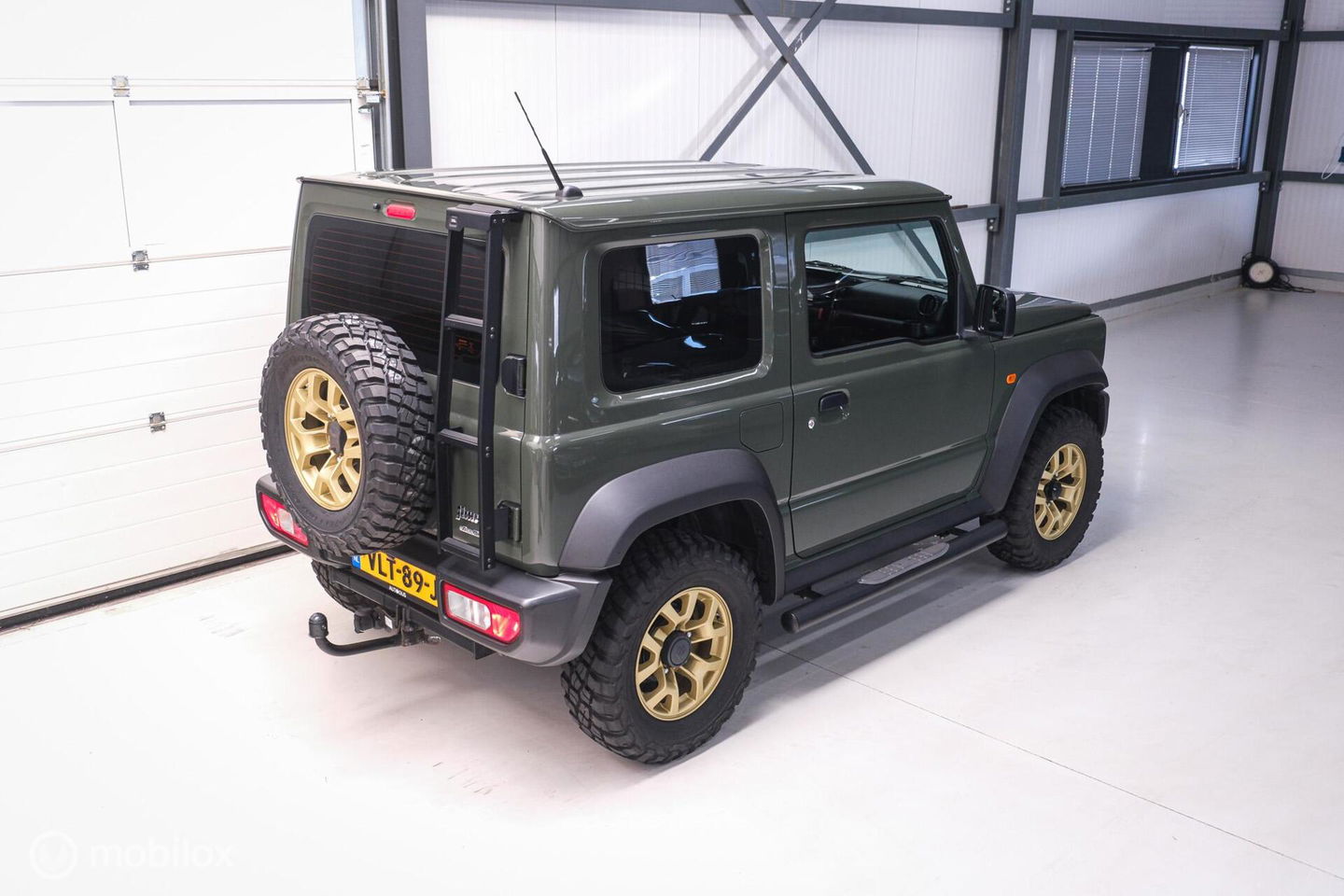 Suzuki Jimny 1.5 All Grip 4x4 | CarPlay | Camera | Stoelverwarming | BF Goodrich | Frontrunner | NL auto NAP | Groen | Lane Assist |
