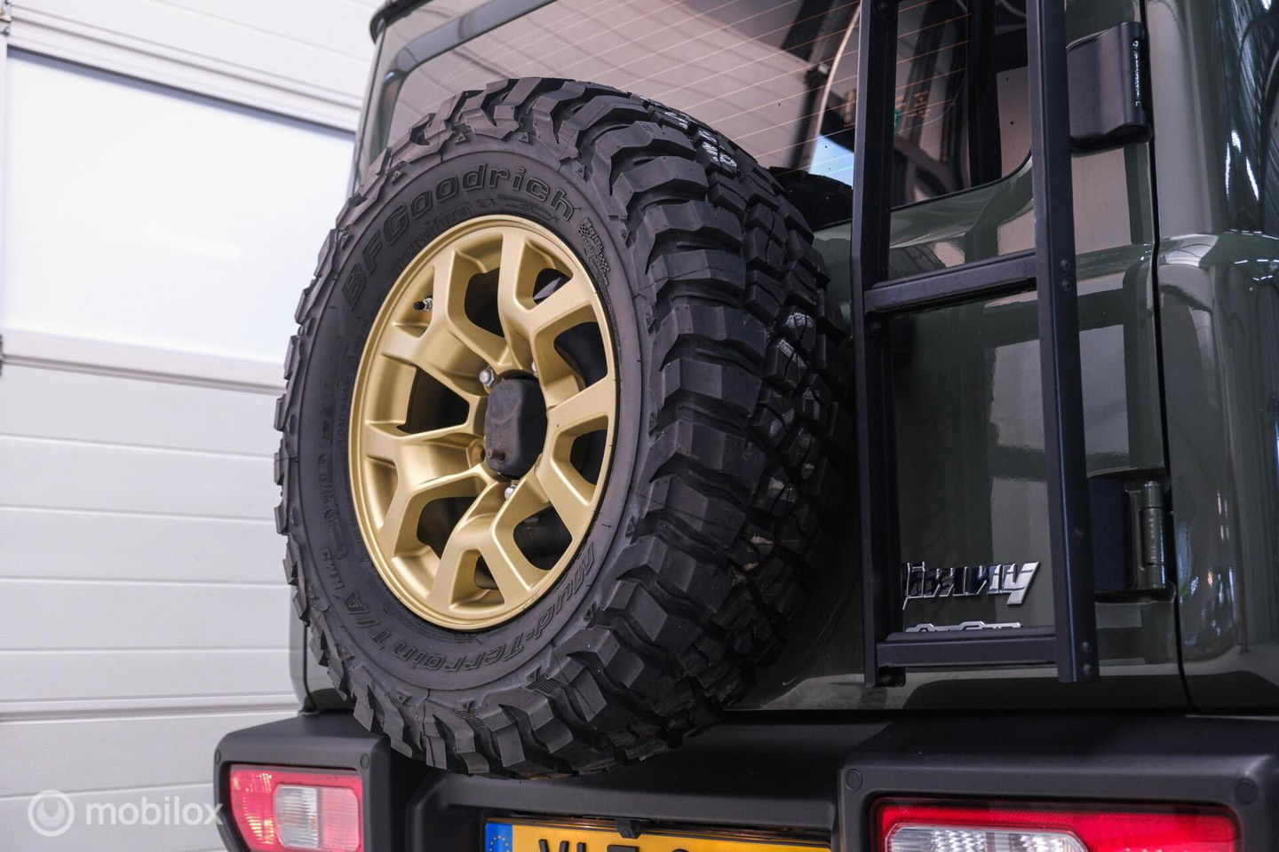Suzuki Jimny 1.5 All Grip 4x4 | CarPlay | Camera | Stoelverwarming | BF Goodrich | Frontrunner | NL auto NAP | Groen | Lane Assist |