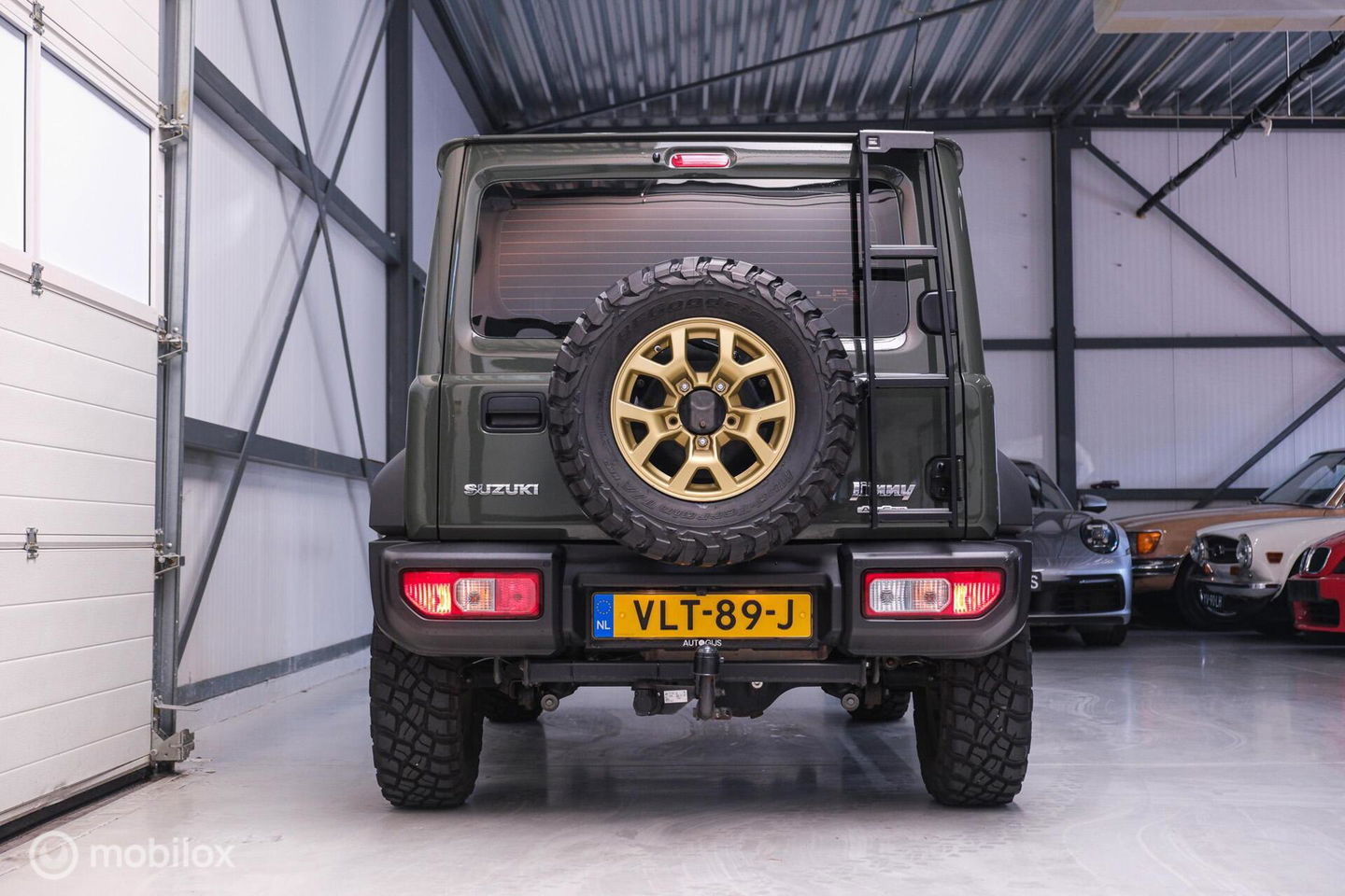 Suzuki Jimny 1.5 All Grip 4x4 | CarPlay | Camera | Stoelverwarming | BF Goodrich | Frontrunner | NL auto NAP | Groen | Lane Assist |