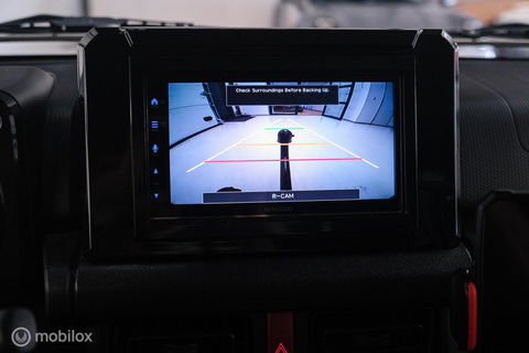 Suzuki Jimny 1.5 All Grip 4x4 | CarPlay | Camera | Stoelverwarming | BF Goodrich | Frontrunner | NL auto NAP | Groen | Lane Assist |