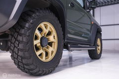Suzuki Jimny 1.5 All Grip 4x4 | CarPlay | Camera | Stoelverwarming | BF Goodrich | Frontrunner | NL auto NAP | Groen | Lane Assist |
