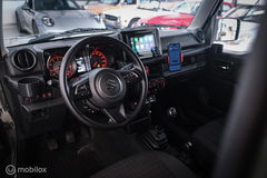 Suzuki Jimny 1.5 All Grip 4x4 | CarPlay | Camera | Stoelverwarming | BF Goodrich | Frontrunner | NL auto NAP | Groen | Lane Assist |
