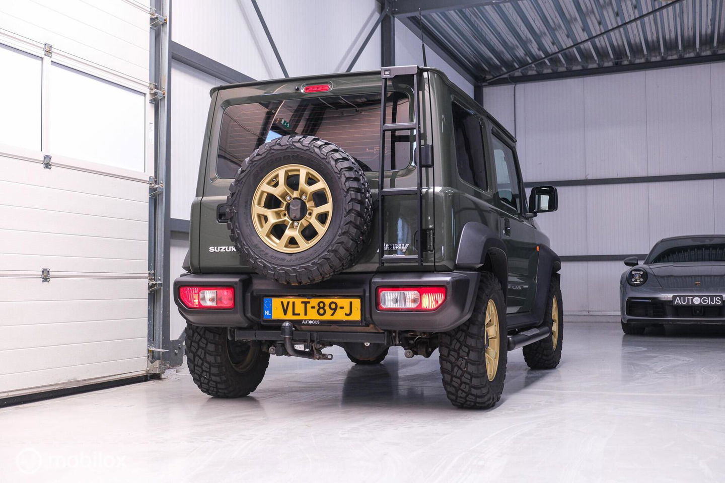 Suzuki Jimny 1.5 All Grip 4x4 | CarPlay | Camera | Stoelverwarming | BF Goodrich | Frontrunner | NL auto NAP | Groen | Lane Assist |