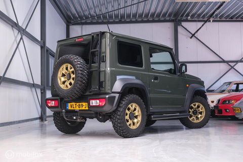 Suzuki Jimny 1.5 All Grip 4x4 | CarPlay | Camera | Stoelverwarming | BF Goodrich | Frontrunner | NL auto NAP | Groen | Lane Assist |