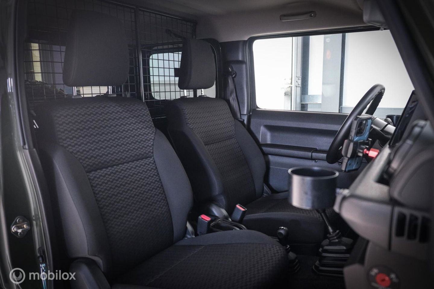 Suzuki Jimny 1.5 All Grip 4x4 | CarPlay | Camera | Stoelverwarming | BF Goodrich | Frontrunner | NL auto NAP | Groen | Lane Assist |