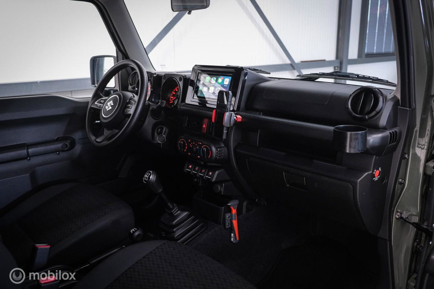 Suzuki Jimny 1.5 All Grip 4x4 | CarPlay | Camera | Stoelverwarming | BF Goodrich | Frontrunner | NL auto NAP | Groen | Lane Assist |