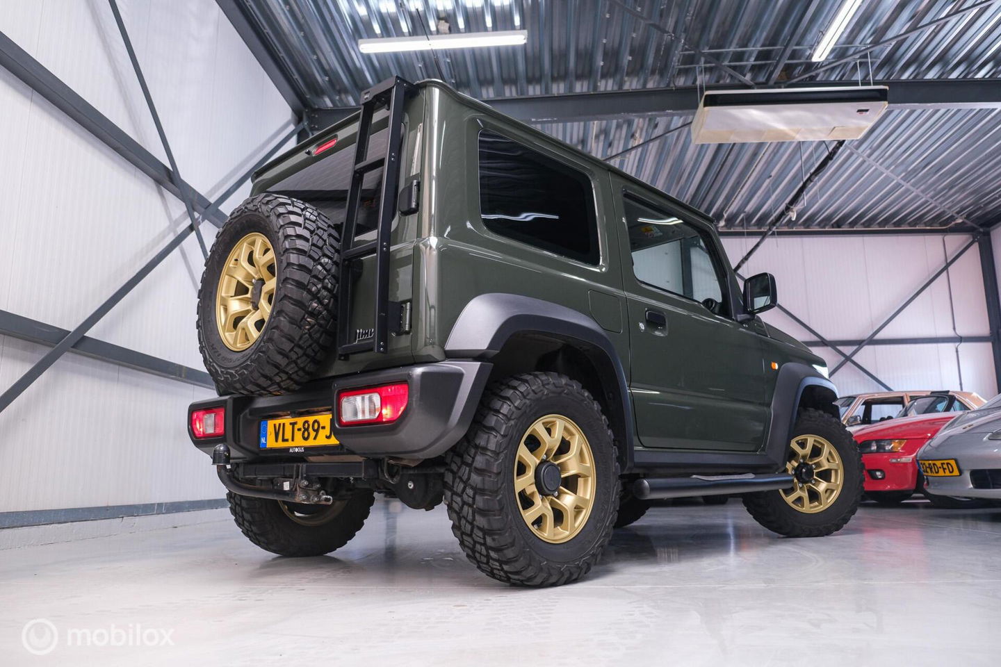 Suzuki Jimny 1.5 All Grip 4x4 | CarPlay | Camera | Stoelverwarming | BF Goodrich | Frontrunner | NL auto NAP | Groen | Lane Assist |