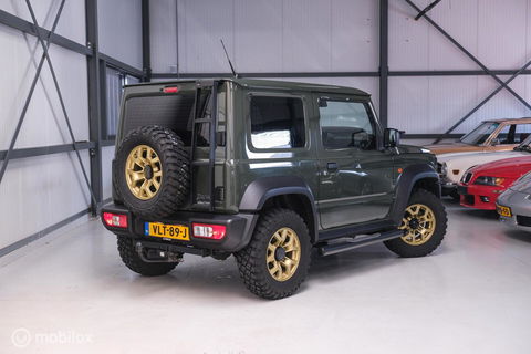 Suzuki Jimny 1.5 All Grip 4x4 | CarPlay | Camera | Stoelverwarming | BF Goodrich | Frontrunner | NL auto NAP | Groen | Lane Assist |