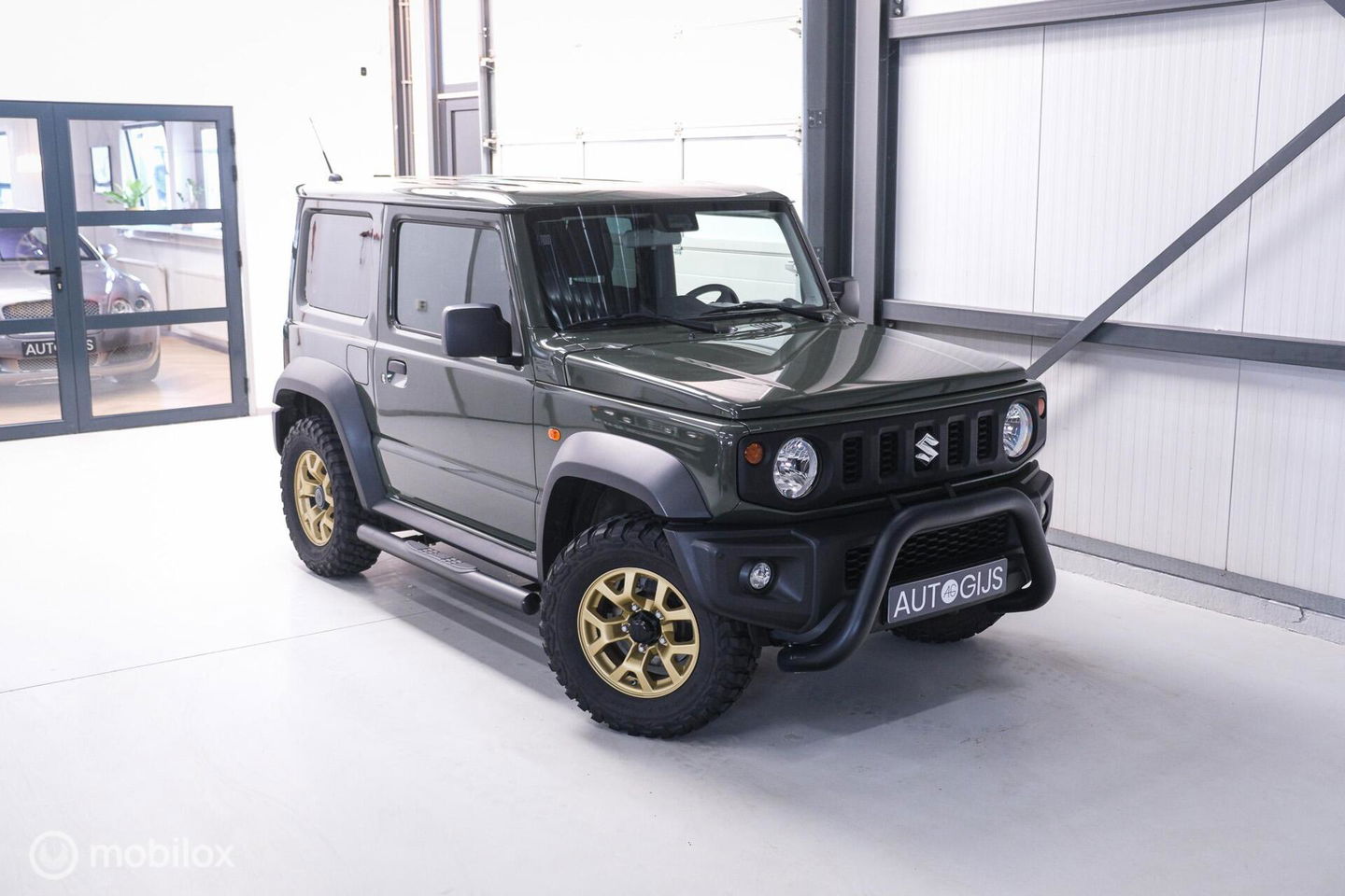 Suzuki Jimny 1.5 All Grip 4x4 | CarPlay | Camera | Stoelverwarming | BF Goodrich | Frontrunner | NL auto NAP | Groen | Lane Assist |