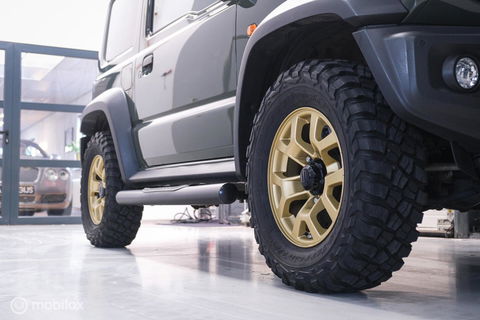 Suzuki Jimny 1.5 All Grip 4x4 | CarPlay | Camera | Stoelverwarming | BF Goodrich | Frontrunner | NL auto NAP | Groen | Lane Assist |