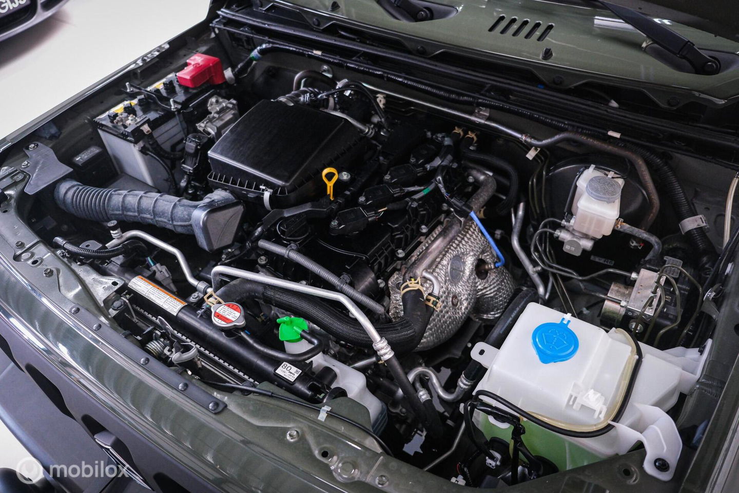 Suzuki Jimny 1.5 All Grip 4x4 | CarPlay | Camera | Stoelverwarming | BF Goodrich | Frontrunner | NL auto NAP | Groen | Lane Assist |