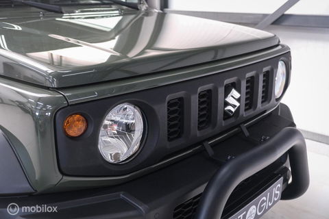 Suzuki Jimny 1.5 All Grip 4x4 | CarPlay | Camera | Stoelverwarming | BF Goodrich | Frontrunner | NL auto NAP | Groen | Lane Assist |