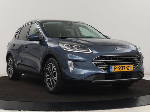 Ford Kuga 2.5 PHEV Titanium X | Trekhaak | Stoelverwarming | Camera | Carplay | Half leder | Achterbankverwarming | Navigatie | Full LED | Climate control | Parkeerhulp | Keyless | B&O Sound | Plug In