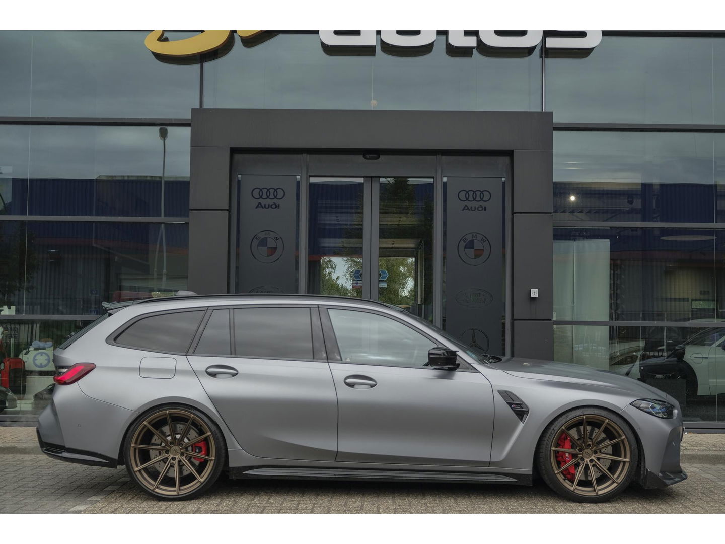 BMW M3 Touring Competition 510pk xDrive Widescreen Frozen grey *BTW* Head-up Adaptive cruise CSL grille 21" LMV