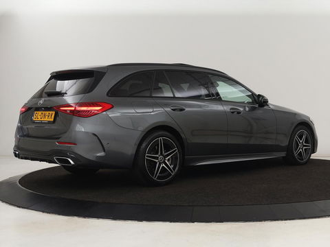 Mercedes-Benz C-Klasse 300e AMG Night | Panoramadak | Trekhaak | Sfeerverlichting | Massage | Adaptive cruise | Stoelverwarming | 360 Camera | Leder | Memory | Carplay | PHEV | Plug In
