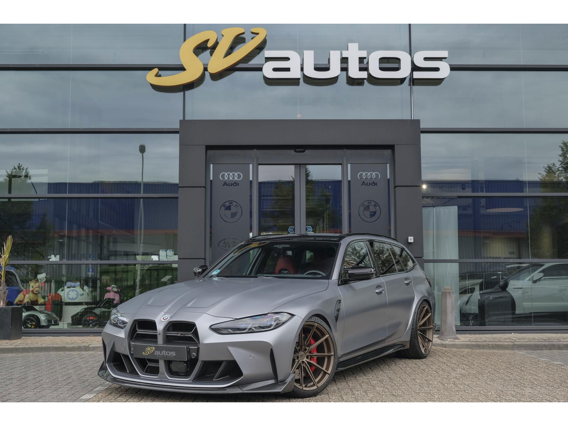BMW M3 Touring Competition 510pk xDrive Widescreen Frozen grey *BTW* Head-up Adaptive cruise CSL grille 21" LMV