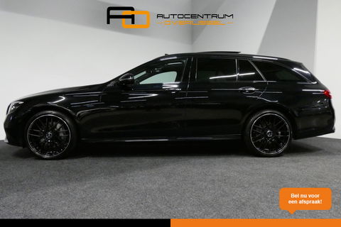 Mercedes-Benz E-Klasse Estate 300 e AMG Line / E63 AMG Grill / E63 AMG Diffuser / Panoramadak / Burmester Sound System / Sfeerverlichting / Luchtvering (achteras) / LED High Performance / 20'' LMV / Night pakket / Apple Carplay - Andriod auto / Stoelverwarming / Trekhaak (zwenk