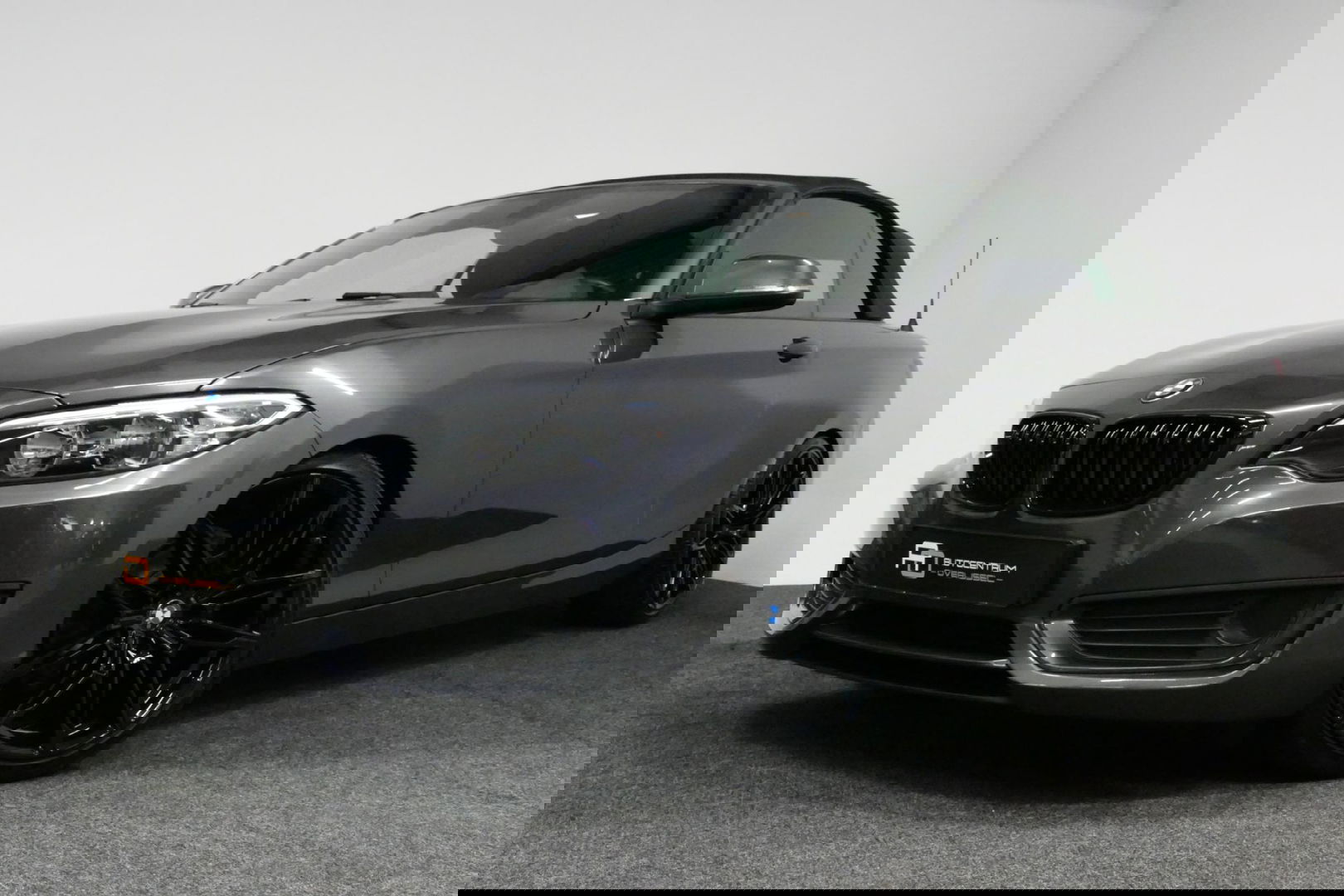 BMW 2 Serie Cabrio 218i Essential / Stoelverwarming / Windscherm / Climatronic / 19'' LMV / Parkeersensoren achter / BMW Radio Professional / Licht- & regensensor / Multimedia systeem