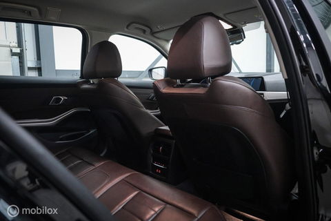 BMW 3 Serie Touring 330e High Executive 290 pk | Trekhaak | Leder | Sportstoelen | NL auto NAP | LED | CarPlay | Stoelverwarming |
