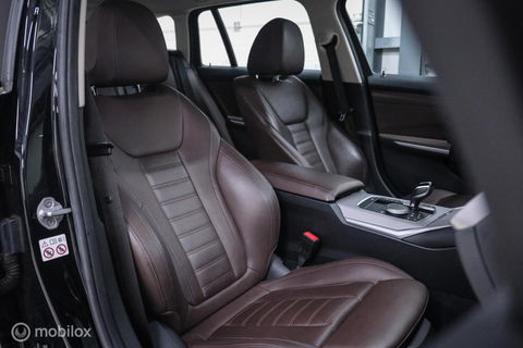 BMW 3 Serie Touring 330e High Executive 290 pk | Trekhaak | Leder | Sportstoelen | NL auto NAP | LED | CarPlay | Stoelverwarming |